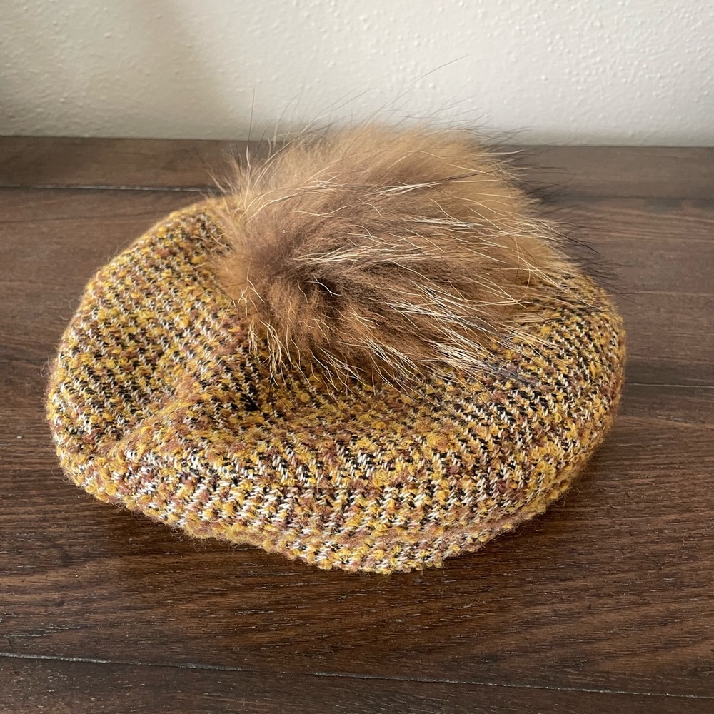 Beret hat with fur puff on top.  Grace Hats